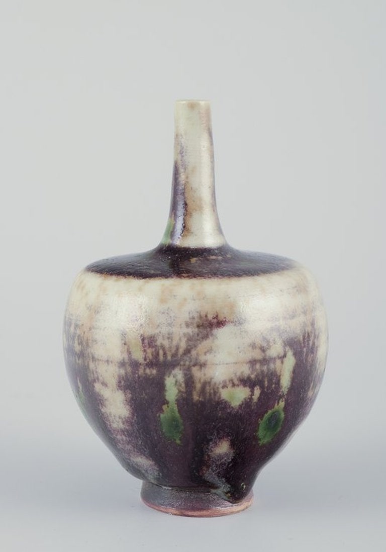 Höganäs, Sweden. Small unique ceramic vase. Glaze in violet tones. Approx. 1970/80s.: Höganäs. Small unique ceramic vase. Glaze in violet tones. Approx. 1970/80s Marked. Perfect condition. Dimensions: H 8.5 cm x D 5.0 cm. Höganäs Keramik was founded in 1909 by Sigfr