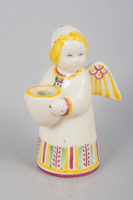 Aluminia, faience angel candlestick in yellow, pink and green tones, Denmark. Designed by Nils: Aluminia, faience angel candlestick. Designed by Nils Thorsson around 1942. Decorative angel figure in glazed faience with hand-painted polychrome decoration in yellow, pink and green tones, designed 