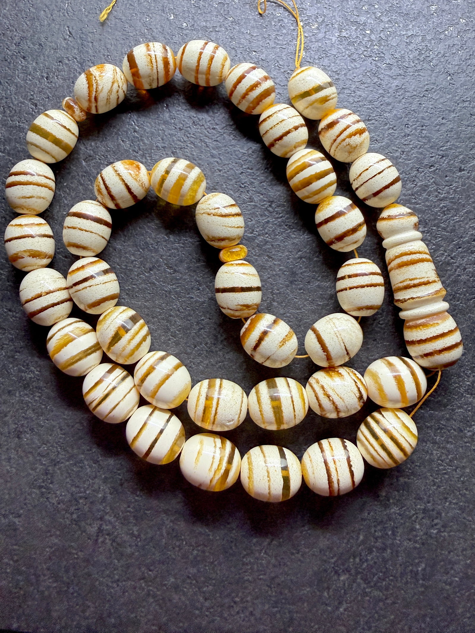 Extraordinary Amber Tesbih made from Round Amber beads with Tiger Pattern: Title:Extraordinary Amber Tesbih made from Round Amber beads with Tiger Pattern Metal:None Gemstone:Reconstituted Amber Weight:62.44 g Size:15x12mm Made of:(Reconstituted Amber or Whole