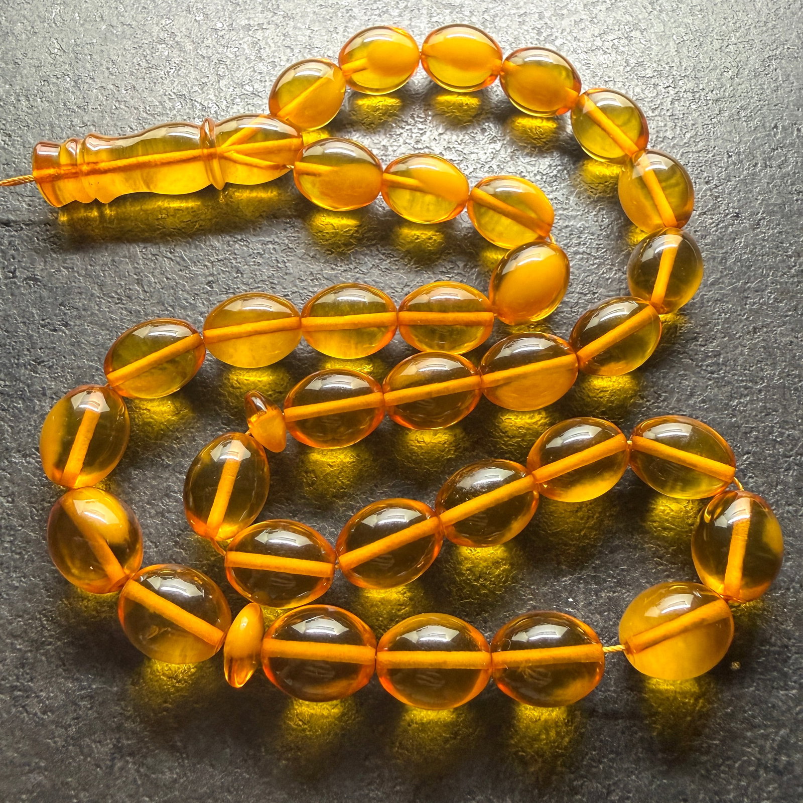 Grand Amber Tesbih made from Round Amber beads: Title:Grand Amber Tesbih made from Round Amber beads Metal:None Gemstone:Reconstituted Amber Weight:69.2 g Size:17x13 mm Made of:(Reconstituted Amber or Whole Stone):Reconstituted Amber Additional