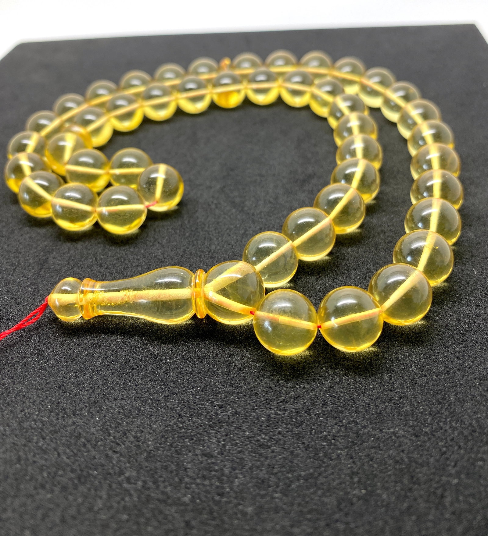 Grand Amber Tesbih made from Round Amber beads: Title:Grand Amber Tesbih made from Round Amber beads Metal:None Gemstone:Amber Weight:42.5 g Size:Bead size: 11.55 mm Bead size: 0.455 inches Made of:(Reconstituted Amber or Whole