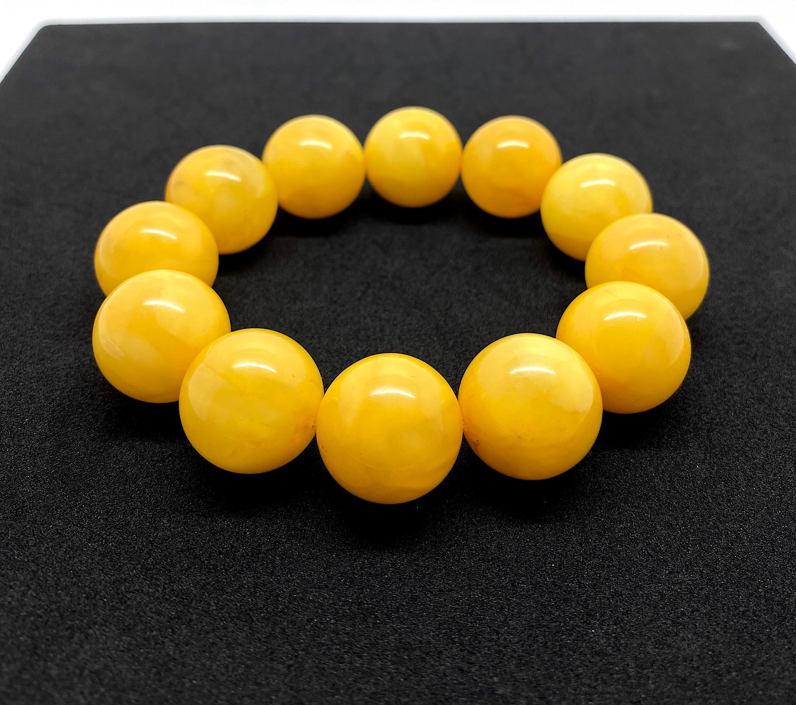 Astonishing Amber Bracelet made from Round Amber beads: Title:Astonishing Amber Bracelet made from Round Amber beads Metal:None Gemstone:Amber Weight:46.0 g Size:Bead size: 19.0 mm Bead size: 0.748 inches Made of:(Reconstituted Amber or Whole