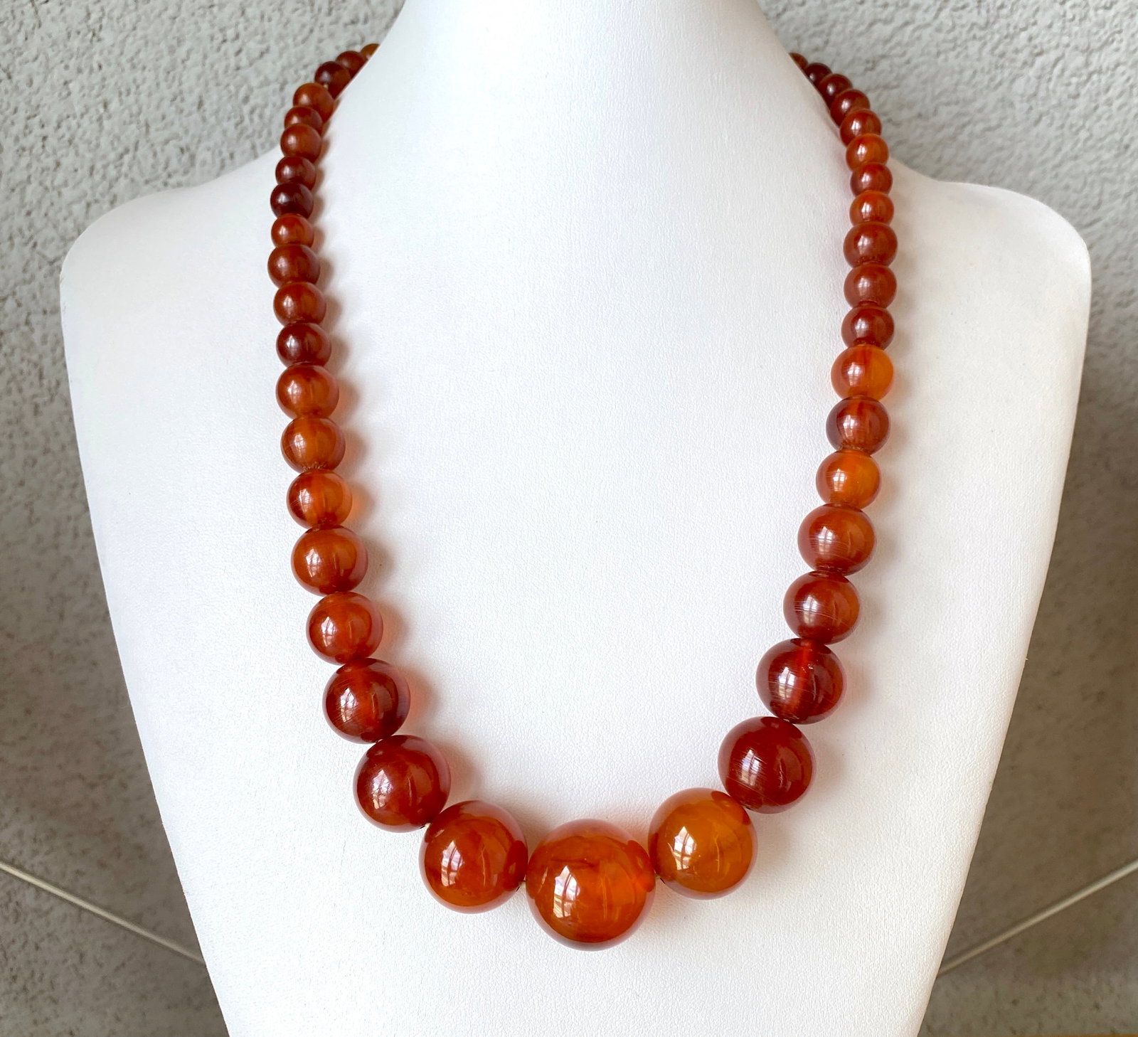 Antique Bakelite Necklace made from Round Bakelite beads: Title:Antique Bakelite Necklace made from Round Bakelite beads Metal:None Gemstone:Bakelite Weight:79.36 g Size:Size: 600.0 x 23.0 x 23.0 mm Size: 23.622 x 0.906 x 0.906 inches Bead size: From 23.0 to
