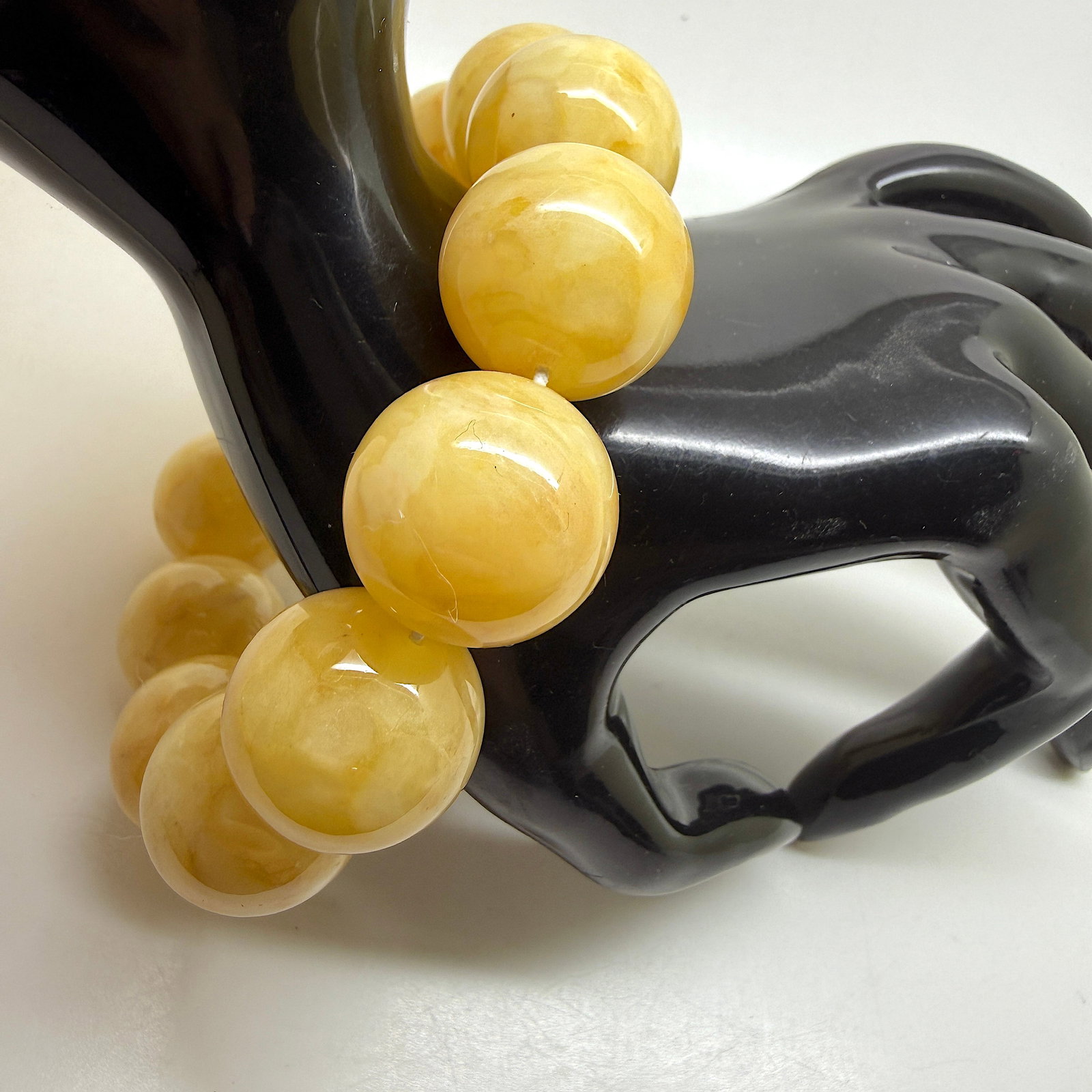 Charming Amber Bracelet: Title:Charming Amber Bracelet Metal:None Gemstone:Reconstituted Amber Weight:53.1 g Size:20mm Made of:(Reconstituted Amber or Whole Stone):Reconstituted Amber Additional information:Charming Amber