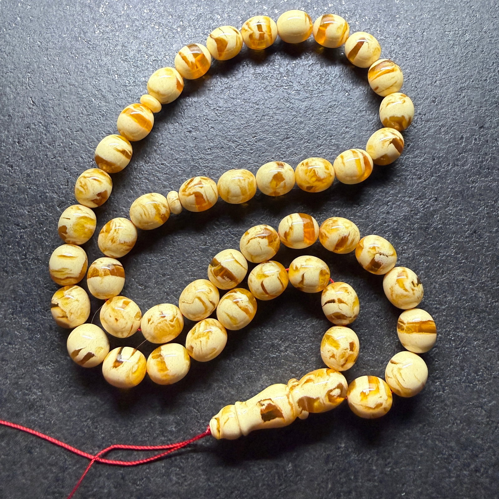 Outstanding Amber Tesbih made from Round Amber beads: Title:Outstanding Amber Tesbih made from Round Amber beads Metal:None Gemstone:Reconstituted Amber Weight:56.72 g Size:13x12 mm Made of:(Reconstituted Amber or Whole Stone):Reconstituted Amber
