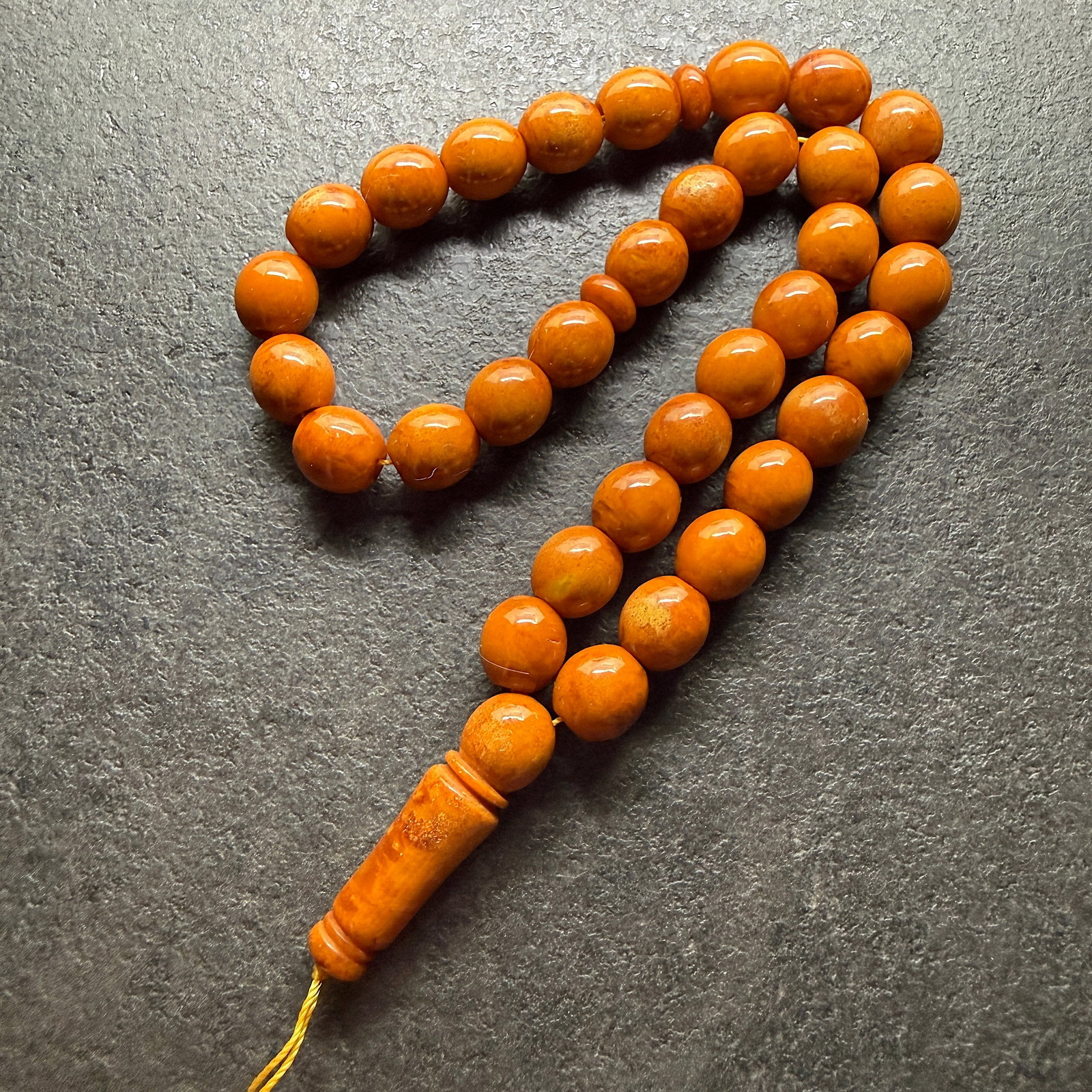 Splendid Amber Tesbih made from Round Amber beads: Title:Splendid Amber Tesbih made from Round Amber beads Metal:None Gemstone:Reconstituted Amber Weight:41.15 g Size:12x12.5mm Made of:(Reconstituted Amber or Whole Stone):Reconstituted Amber