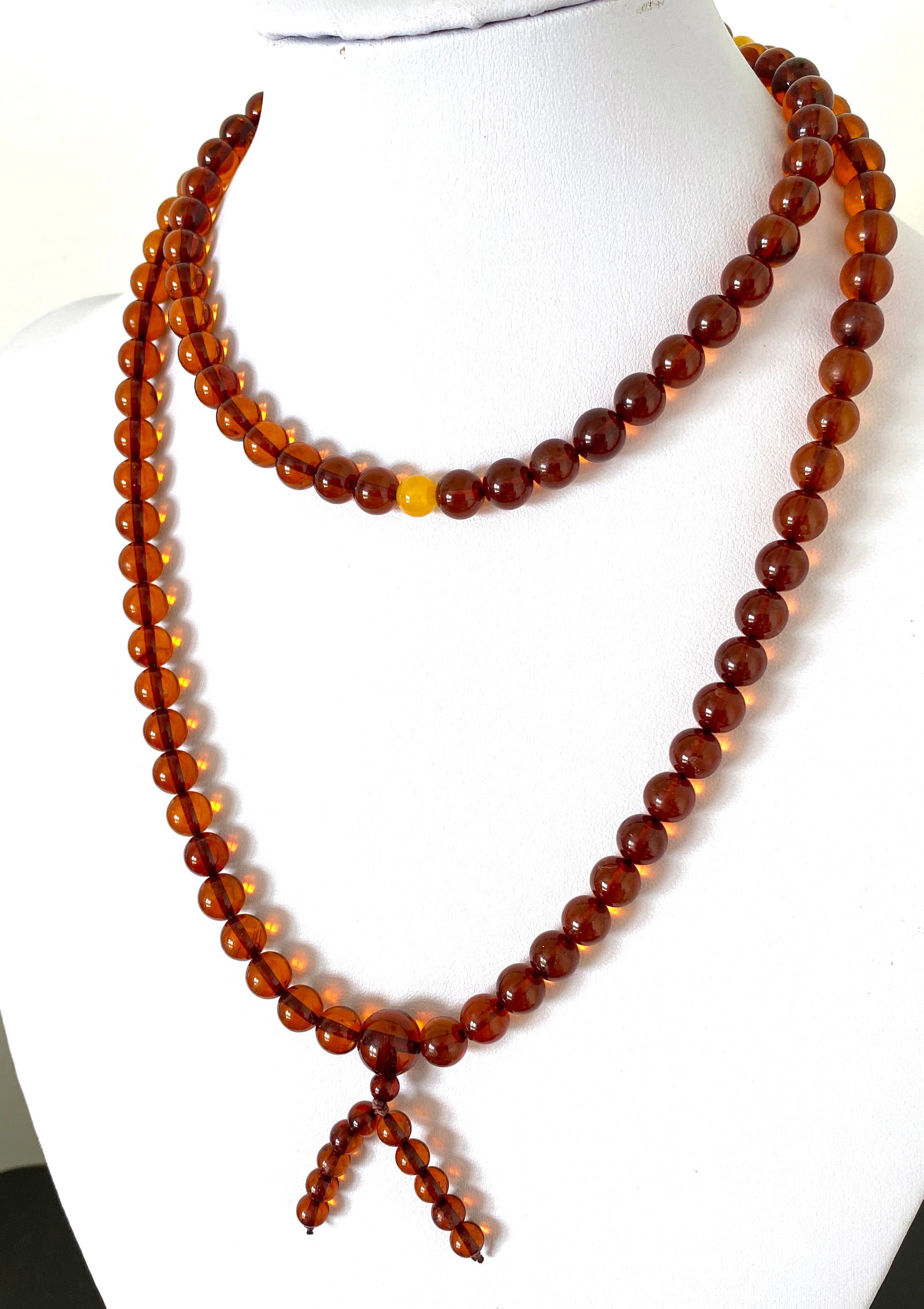 Grand Amber Mala made from Round Amber beads: Title:Grand Amber Mala made from Round Amber beads Metal:None Gemstone:Amber Weight:34.2 g Size:Bead size: 8.0 mm Bead size: 0.315 inches Made of:(Reconstituted Amber or Whole Stone):Whole Stone Addit