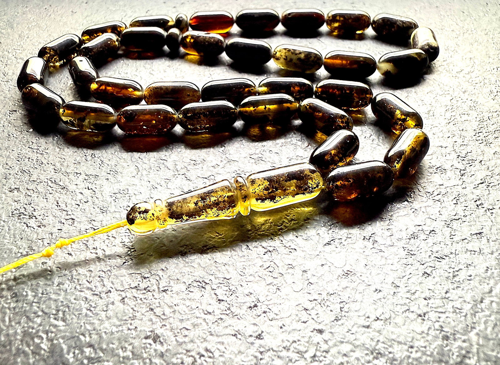 Impressive Amber Tesbih made from Capsule shaped Amber beads: Title:Impressive Amber Tesbih made from Capsule shaped Amber beads Metal:None Gemstone:Amber Weight:26.1 g Size:Bead size: 17.0 x 8.0 mm Bead size: 0.669 x 0.315 inches Made of:(Reconstituted Amber