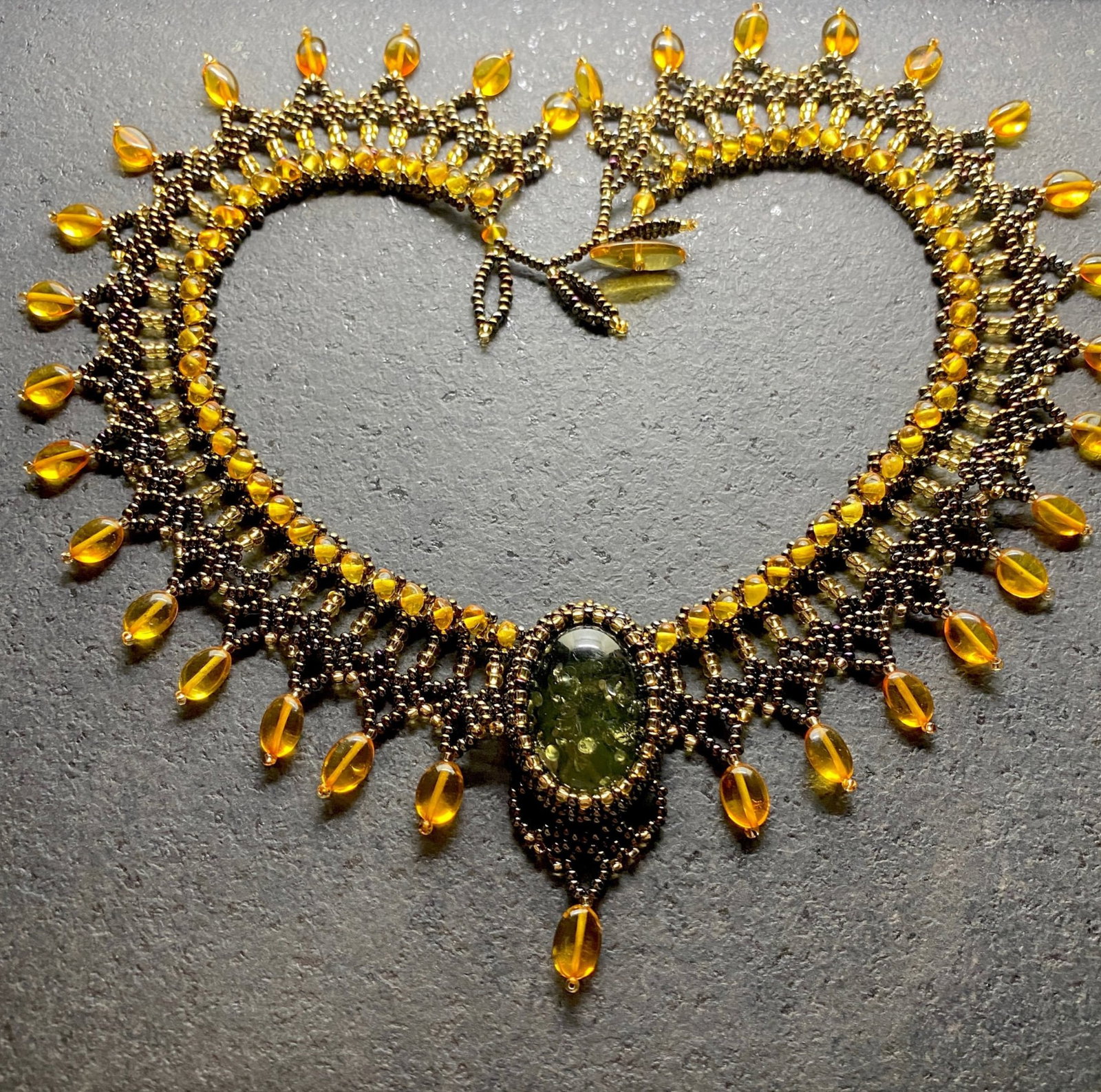 Impressive Vintage Amber Floral Necklace made from leaf like bead ornaments: Title:Impressive Vintage Amber Floral Necklace made from leaf like bead ornaments Metal:None Gemstone:Amber Weight:42.1 g Size:Size: 460.0 x 60.0 x 10.0 mm Size: 18.11 x 2.362 x 0.394 inches Made