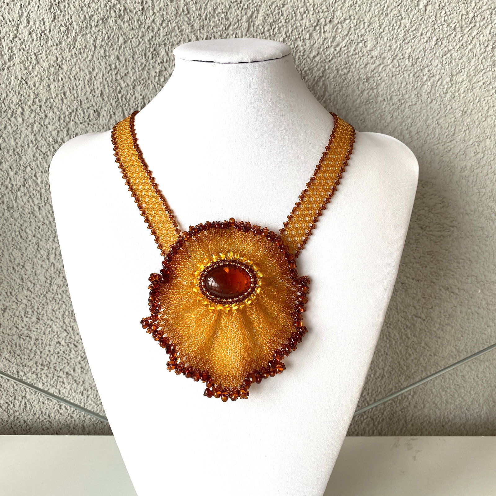 Unique and Alluring Amber Floral Necklace made from leaf like bead ornaments: Title:Unique and Alluring Amber Floral Necklace made from leaf like bead ornaments Metal:None Gemstone:Amber Weight:55.6 g Size:Size: 107.0 x 12.0 x 500.0 mm Size: 4.213 x 0.472 x 19.685 inches Made