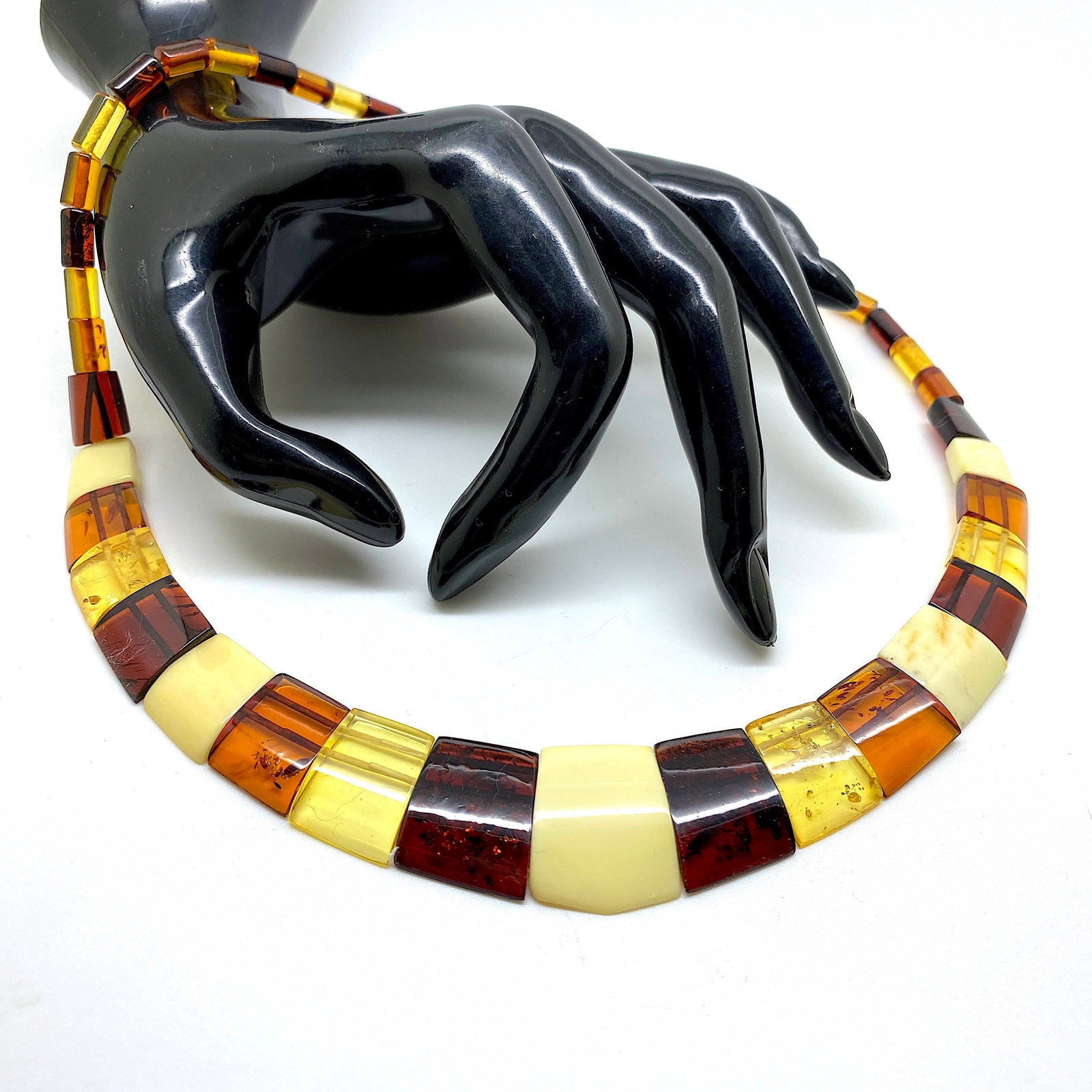 Astonishing Amber Cleopatra necklace: Title:Astonishing Amber Cleopatra necklace Metal:None Gemstone:Amber Weight:17.65 g Size:Size: 460.0 x 22.0 x 5.0 mm Size: 18.11 x 0.866 x 0.197 inches Made of:(Reconstituted Amber or Whole