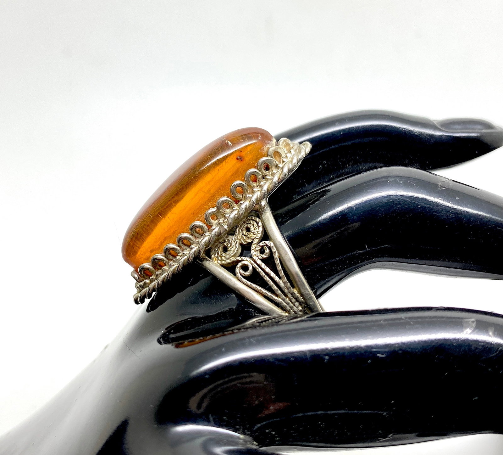 Remarkable Amber Ring: Title:Remarkable Amber Ring Metal:Iron Alloy Gemstone:Amber Weight:8.0 g Size:Inner diameter: 19.0 mm Size: 33.0 x 23.0 x 32.0 mm Size: 1.299 x 0.906 x 1.26 inches Inner diameter: 0.748 inches Made