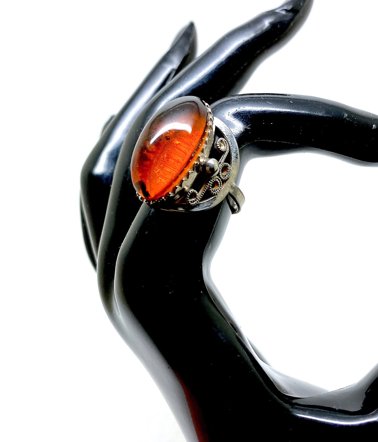 Unique and Impressive Amber Ring: Title:Unique and Impressive Amber Ring Metal:Metal Gemstone:Amber Weight:4.2 g Size:Inner diameter: 16.5 mm Size: 22 x 18 x 28 mm Size: 0.866 x 0.709 x 1.102 inches Inner diameter: 0.65 inches Made