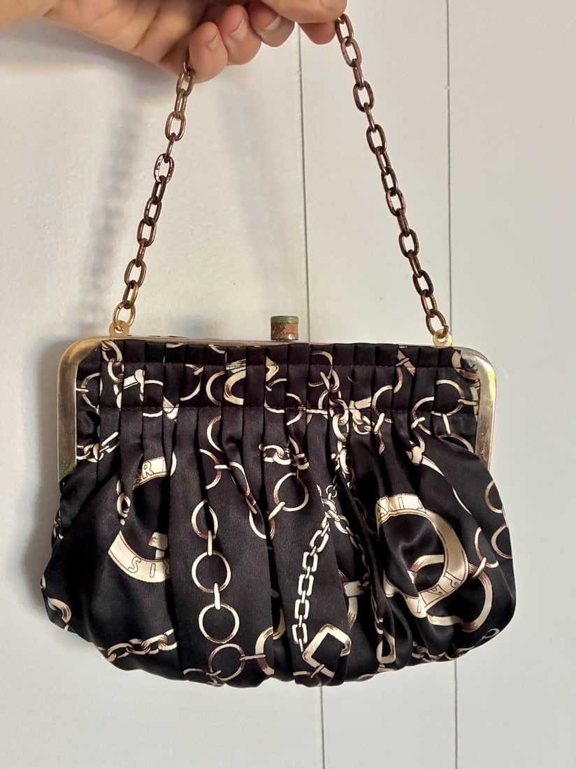 Vintage 1990s Equestrian Novelty Print Top Handle Purse Chain Strap: Acetate but feels silky Equestrian + Paris design elements Off white and brown Black background Generous size for a small bag Brass chain strap Nice clasp Lined, nylon we believe Early 1990s, made fro