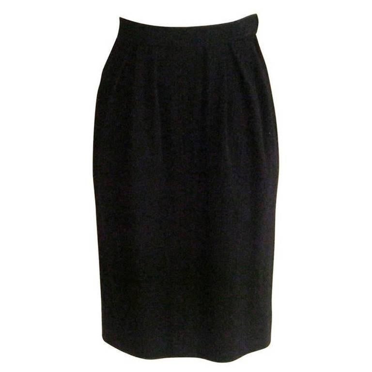 1980s Yves Saint Laurent RG wool skirt: Title:1980s Yves Saint Laurent RG wool skirt Description:A lovely skirt with a nice weight and double stitched seams. The skirt comes below the knee and has a high waist. Additional Details:Designer: 