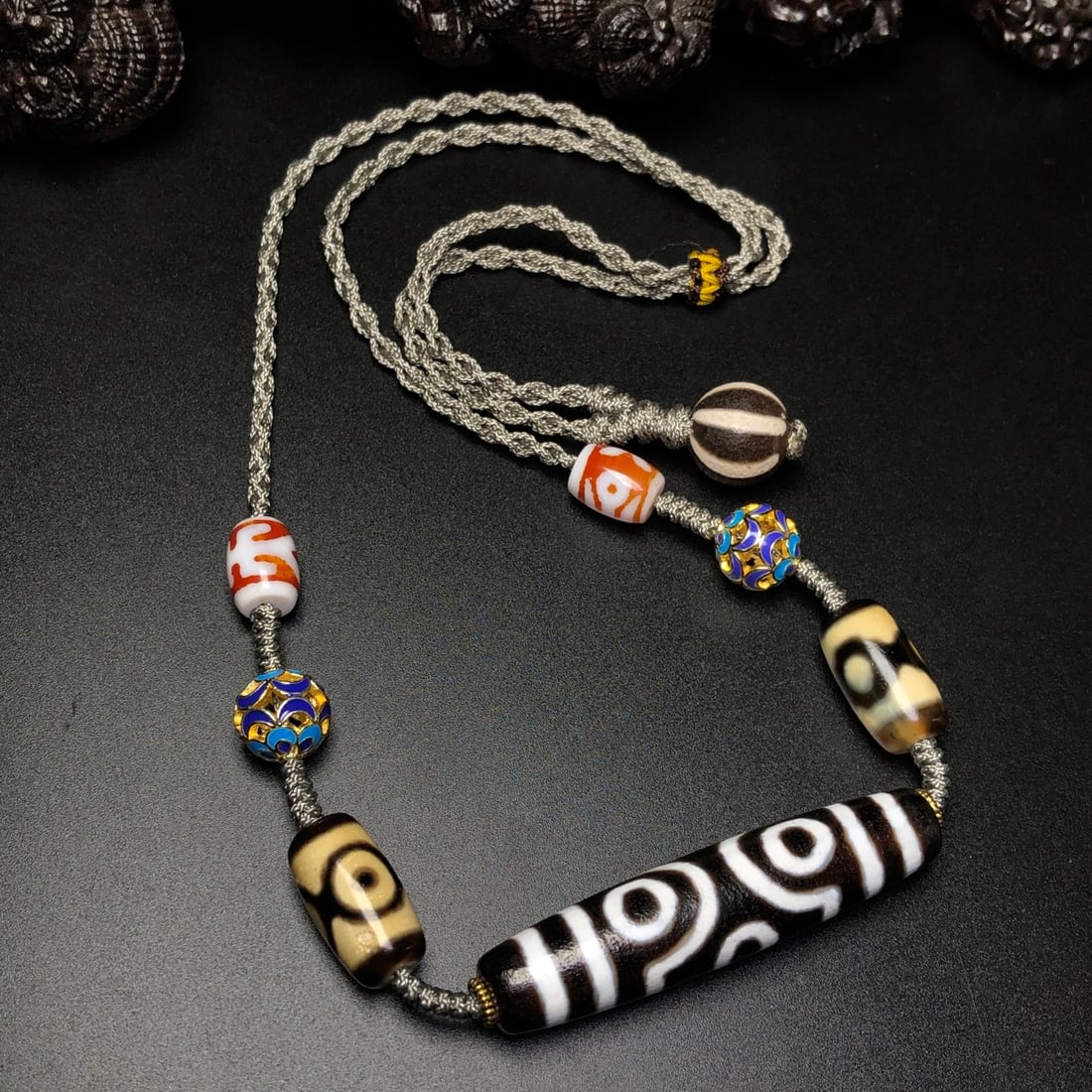 Old Tibetan Three Eyes DZI Agate Pendant w Necklace: Title: Old Tibetan Three Eyes DZI Agate Pendant w Necklace Origin: Chinese Date/Period: After1910 Materials: DZI Agate Dimensions: 58x13(mm) 2.28x0.51(inches) 19x11(mm) 0.75x0.43(inches) Reserve: $150