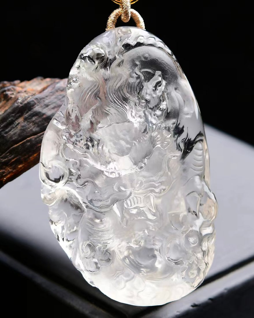Natural White Crystal Carved Dragon Pendant with Certificate: Title: Natural White Crystal Carved Dragon Pendant with Certificate Origin: Chinese Date/Period: After2026 Materials: White Crystal Dimensions: 66x40x14(mm) 2.60x1.57x0.55(inches) Weight 0.20 lbs/88.6