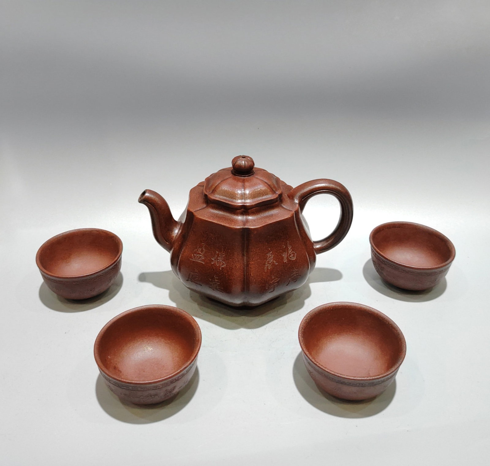 A Set Yixing Zisha Clay Teapot & Cup w Artist Signed: Title: A Set Yixing Zisha Clay Teapot & Cup w Artist Signed Origin: Chinese Materials: Yixing Zisha Dimensions: 170x120(mm) 6.69x4.72(inches) Reserve: $499.00 Shipping: Domestic: Shipping rates are de