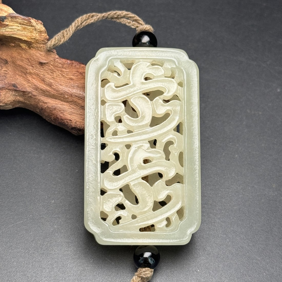 Openwork Hetian Jade Sachet Pendant: Title: Openwork Hetian Jade Sachet Pendant Origin: Chinese Date/Period: After1900 Materials: Hetian Jade Dimensions: 35x60x13(mm) 1.38x2.36x0.51(inches) Weight 0.10 lbs/46g Reserve: $278.00 Shipping: 