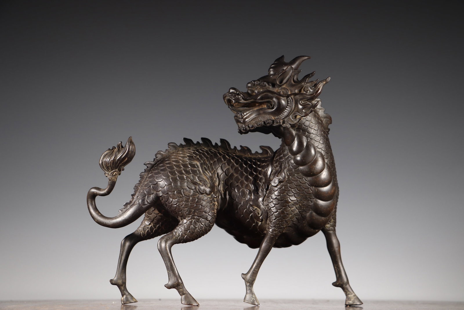Old Bronze Kylin Statue: Title: Old Bronze Kylin Statue Origin: Chinese Date/Period: After1800 Materials: Bronze Dimensions: 275x90x280(mm) 10.83x3.54x11.02(inches) Weight 8.16 lbs/3700g Reserve: $1,999.00 Shipping: