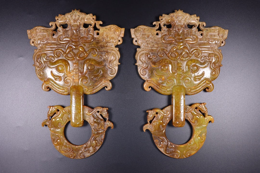 A Pair Hetian Jade Beast Door knocker: Title: A Pair Hetian Jade Beast Door knocker Origin: Chinese Date/Period: After1860 Materials: Hetian Jade Dimensions: 240x160x20(mm) 9.45x6.30x0.79(inches) Weight 1.24 lbs/564g Reserve: $4,799.00 Shi
