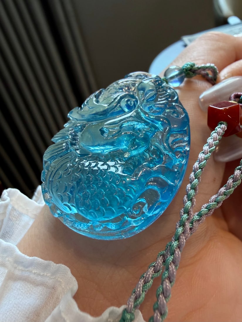 Natural Aquamarine Hand Carved Dragon Pendant: Title: Natural Aquamarine Hand Carved Dragon Pendant Origin: Chinese Date/Period: After2026 Materials: Aquamarine Dimensions: 40x29x12(mm) 1.57x1.14x0.47(inches) Weight 0.05 lbs/24.7g Reserve: