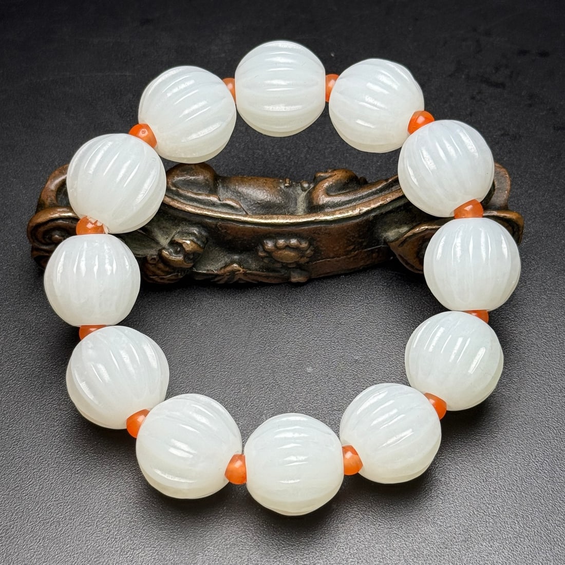 Superb White Hetian Jade Pumpkin Beads Bracelet: Title: Superb White Hetian Jade Pumpkin Beads Bracelet Origin: Chinese Date/Period: After2000 Materials: Hetian Jade Dimensions: 19(mm) 0.75(inches) Weight 0.25 lbs/115g Reserve: $1,999.00 Shipping: D