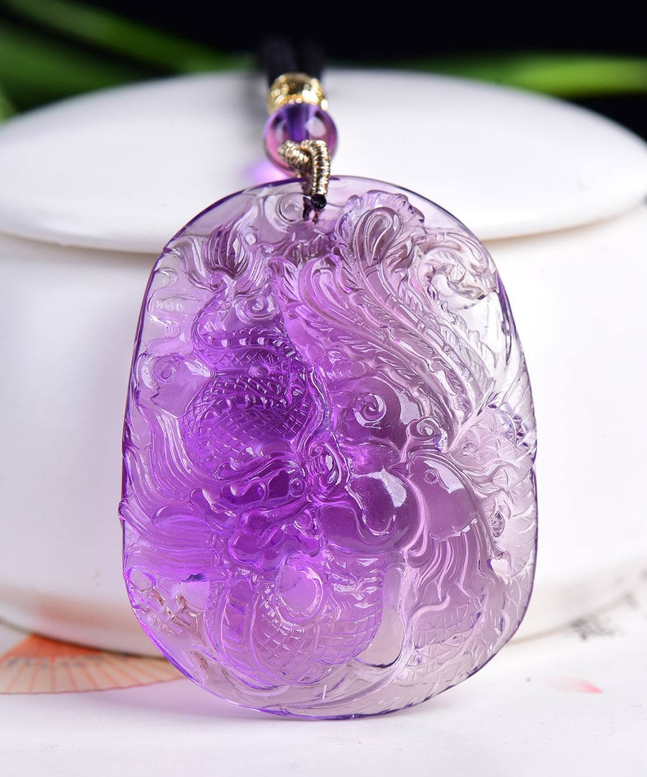 Natural Amethyst Hand Carved Dragon Phoenix Pendant with Certificate: Title: Natural Amethyst Hand Carved Dragon Phoenix Pendant with Certificate Origin: Chinese Date/Period: After2026 Materials: Amethyst Dimensions: 53x41x14(mm) 2.09x1.61x0.55(inches) Weight 0.09 lbs/4