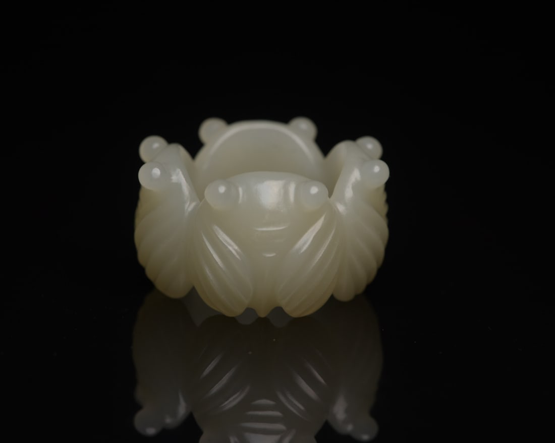 Inside Diameter 23mm Hetian Jade Cicada Ring: Title: Inside Diameter 23mm Hetian Jade Cicada Ring Origin: Chinese Date/Period: After1900 Materials: Hetian Jade Dimensions: 32x23x20(mm) 1.26x0.91x0.79(inches) Weight 0.05 lbs/21g Reserve: $120.00 S