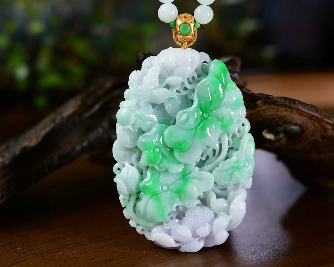 Natural Green Jadeite Hand Carved Lotus Pendant with Certificate: Title: Natural Green Jadeite Hand Carved Lotus Pendant with Certificate Origin: Chinese Date/Period: After2026 Materials: Jadeite Dimensions: 68x47.3x10.5(mm) 2.68x1.86x0.41(inches) Reserve: $1,366.00