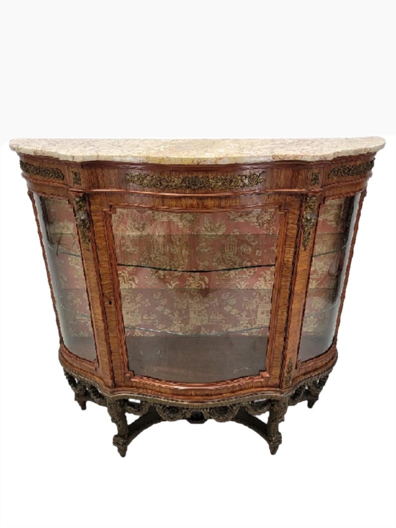 Antique French Curved Glass Vitrine Display Cabinet: Title: Antique French Curved Glass Vitrine Display Cabinet Description: Antique French Louis Style Curved Glass Marble Top Vitrine Display CabinetThis exquisite Antique French Louis Style Vitrine