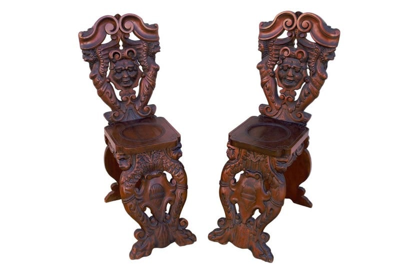 Antique Italian Renaissance Revival Style Figural Side Chairs - Pair: Title: Antique Italian Renaissance Revival Style Figural Side Chairs - Pair Description: Antique Italian Renaissance Revival Rustic Carved Ornate Figural Walnut Hall Chairs - Pair Circa Late 19th Cent