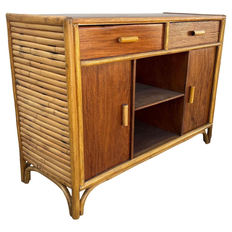 Restored Early Mid-century Stacked Rattan Credenza TV Stand w/ Mahogany Top: This beautifully restored Paul Frankl-inspired Mid-century era mahogany and stacked rattan credenza which works well as a TV Stand. The credenza features a center bookshelf with 2 swing doors on each 