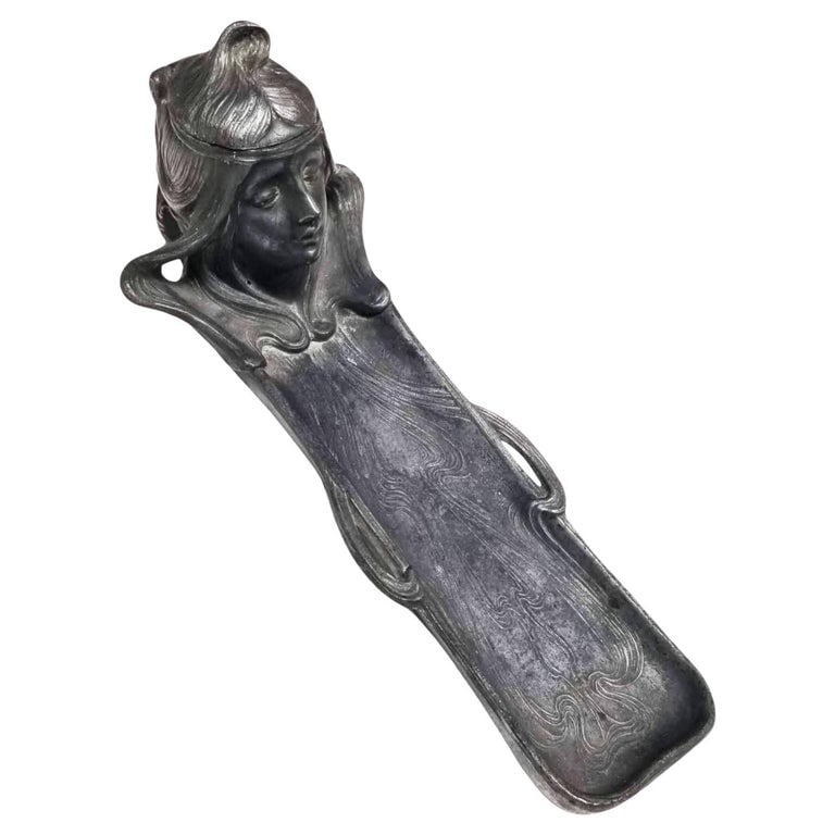 Early Century Art Nouveau Ink Well and Pen Holder: This exquisite vintage Art Nouveau inkwell and pen holder is a true testament to the elegance and intricate craftsmanship of the early 20th century. Crafted from ornate metalwork, this inkwell takes o