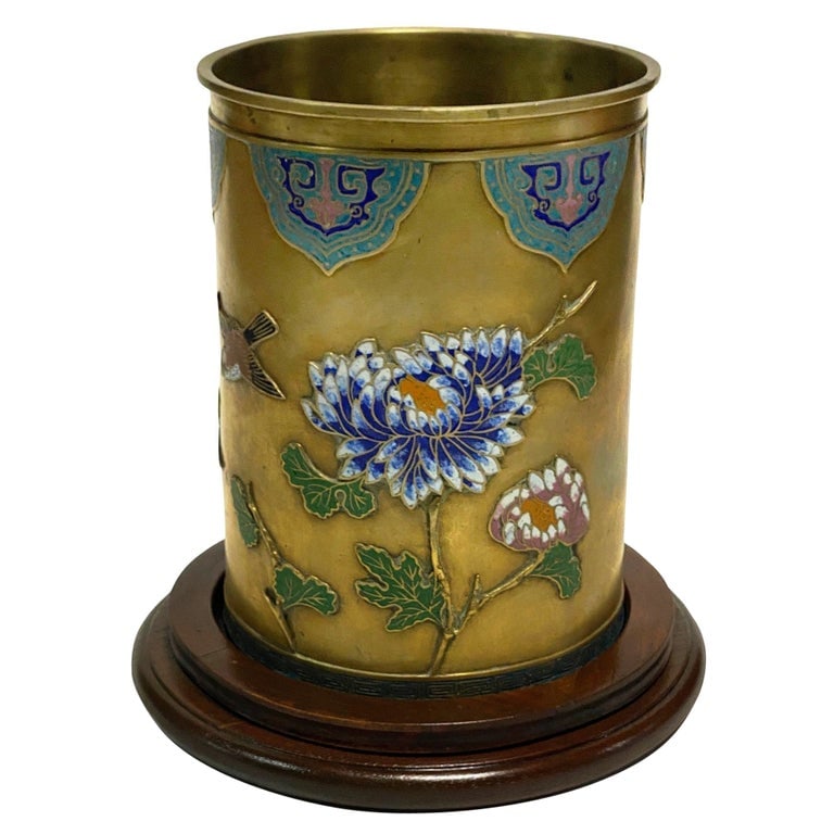 Chinese Floral Bronze Cloisonne Enamel Cylinder Vase w/ Wood Base: 20th Century Chinese bronze cloisonnÃ© vase features stunning floral and bird pattern recesses in the metal with hand-painted enamel colors. The flora and mythical fauna design features ligh