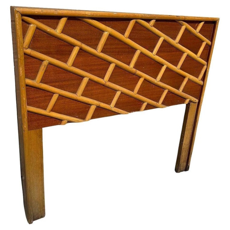 Restored Mid-century Geometric Brick Pattern Rattan & Mahogany Twin Headboad: This restored Mid-century rattan and mahogany twin-size bed headboard blends natural materials with an elegant design. The rattan frame features rattan poles in a geometric brick wall pattern,