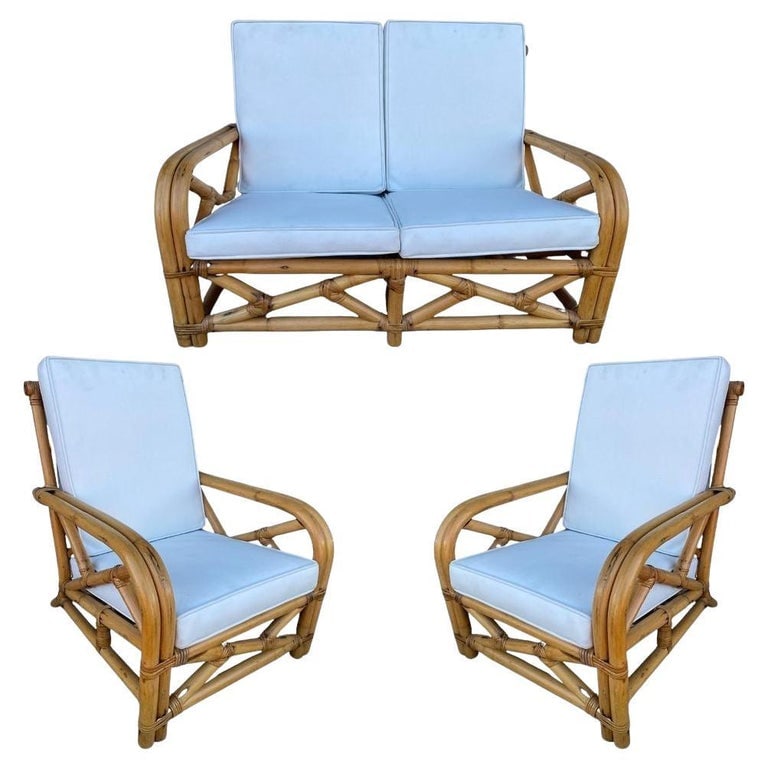Restored Child Size "1949er" Two-Strand Rattan Sofa & Lounge Chair Set: Set of rare Paul Frankl inspired child-size "1949er" two-strand rattan living-room set including a pair of lounge chairs with a matching sofa. Both the chairs and the sofas feature the 1949er arms mad