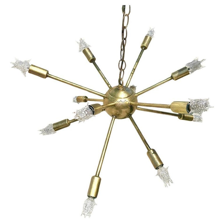 Mid-Century Brass Sputnik Chandelier w/ Starburst Bulbs: Original Mid-century 11 light Sputnik chandelier inspired by the iconic Sputnik satellite launched in 1957, features a central sphere with 11 arms radiating outwards, each ending in a custom