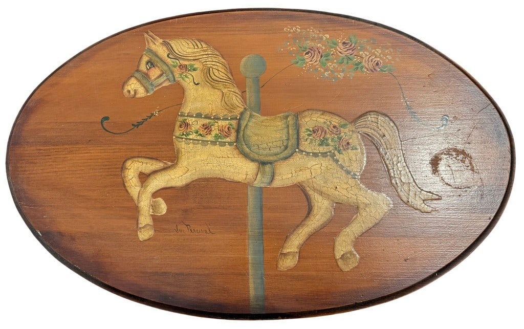 Sue Percival Hand-Painted Carousel Horse Pedestal Table: A charming vintage wooden pedestal table featuring a hand-painted carousel horse design on its oval top. The horse is depicted in a classic fairground style with intricate detailing and floral