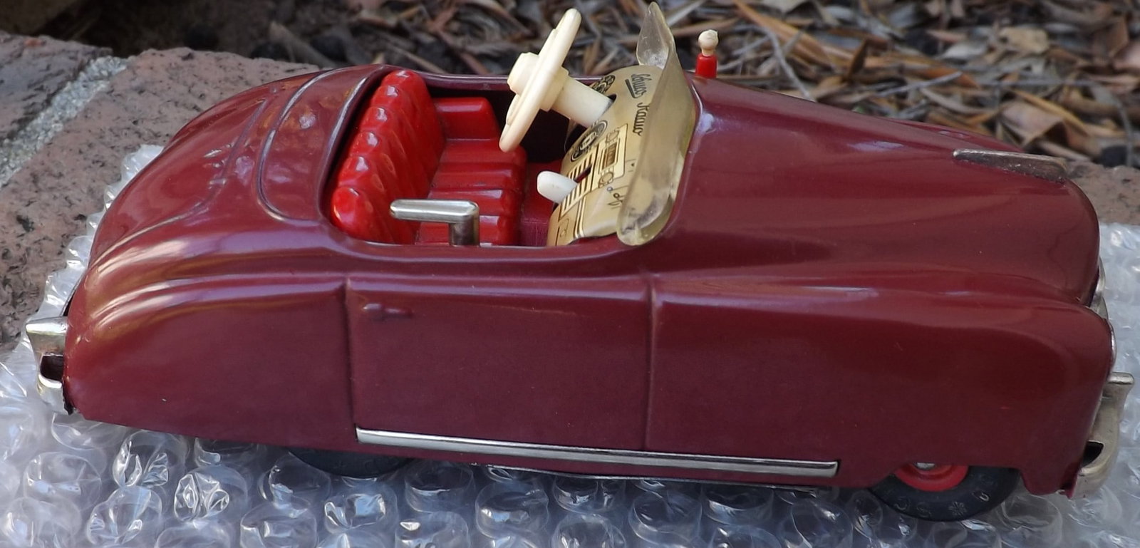 Schuco Radio 4012 (made in US Zone Germany,) two windup motors, one propels the car, the other one - 3