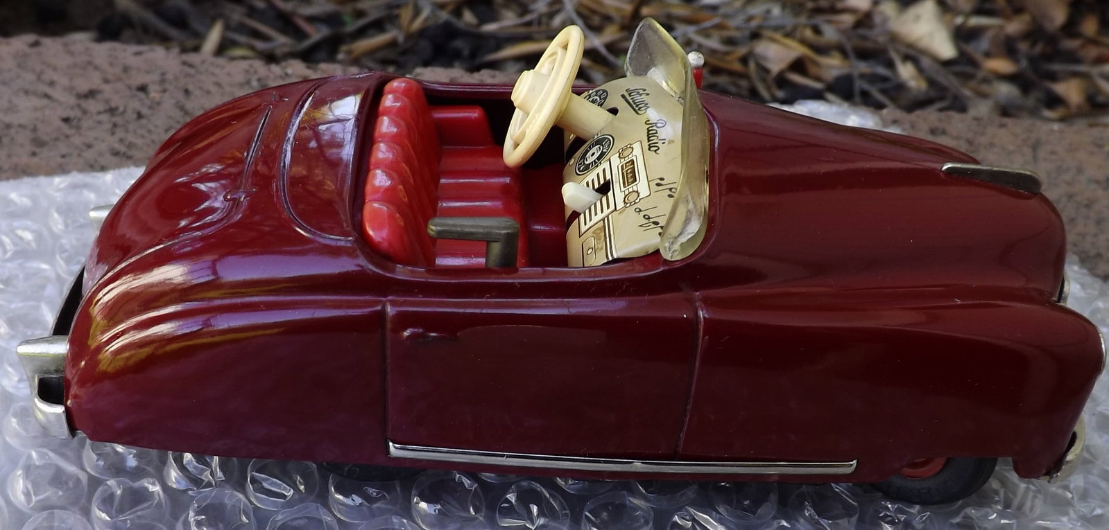 Schuco Radio 4012 (made in US Zone Germany,) two windup motors, one propels the car, the other one - 3