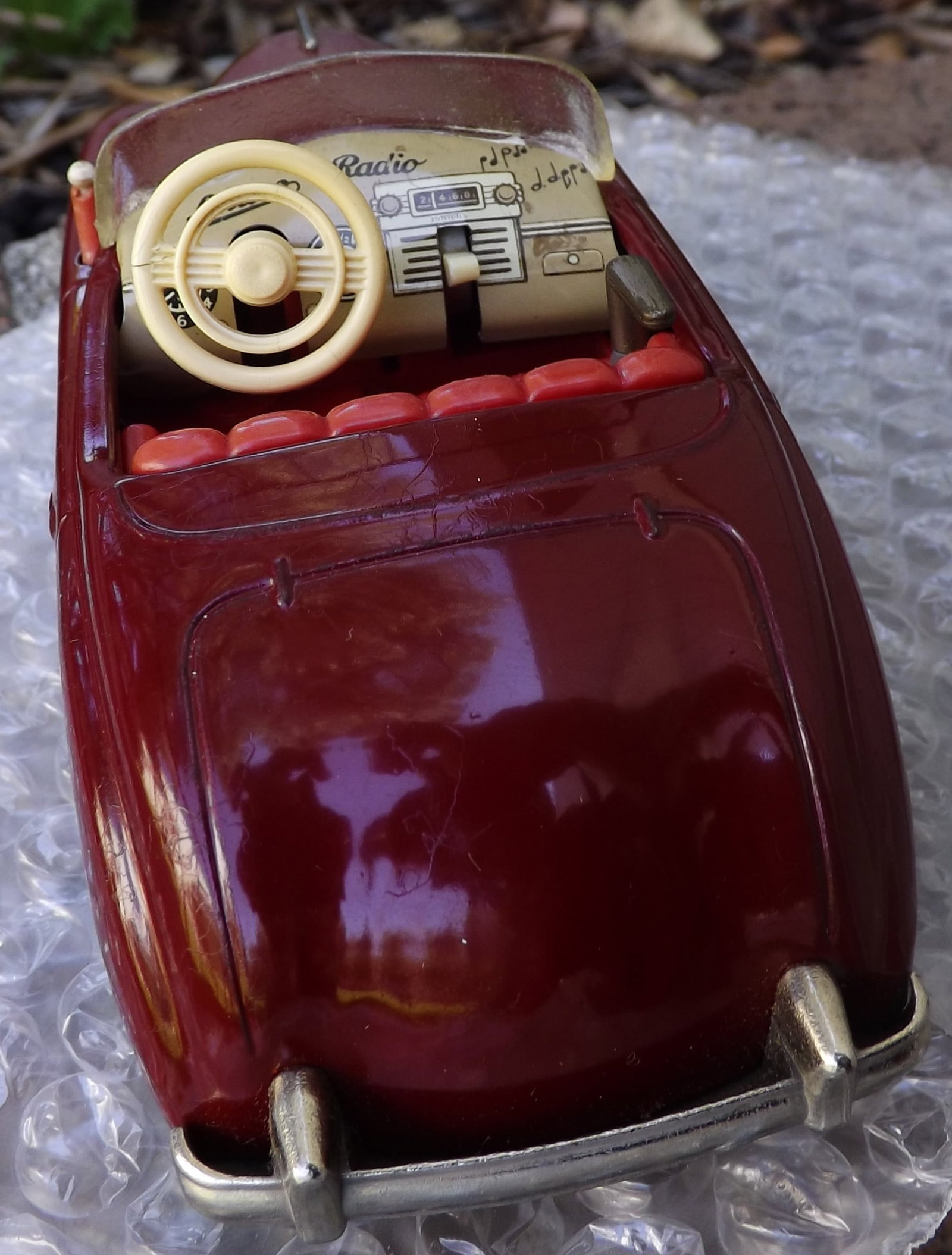Schuco Radio 4012 (made in US Zone Germany,) two windup motors, one propels the car, the other one - 4