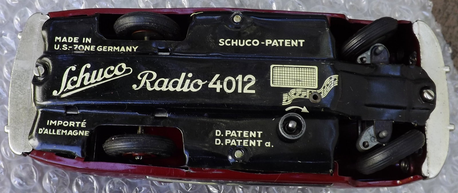 Schuco Radio 4012 (made in US Zone Germany,) two windup motors, one propels the car, the other one - 5