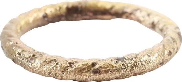 FINE VIKING TWISTED RING, 9TH CENTURY AD, SIZE 9: Wearable size 9. The band, 2.8mm thick, with twisted or roped motif its full circumference which is rare. It also is modeled in the full round with roping to the inside, now showing wear from use. The