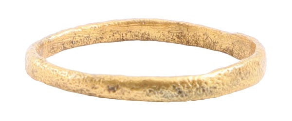 VIKING WOMAN’S WEDDING RING, SIZE 5: 9th-11th century AD. Gilt bronze, slightly over size 5. 1.7mm width band with rounded face. Surface textured from burial. Vikings exchanged rings on the pommel of the groom's sword. Professionally ref