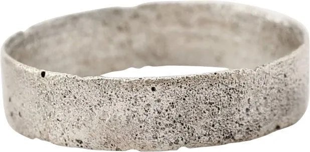 VIKING WEDDING RING, SIZE 8: Late 9th-early 11th century AD, about 1000 years old. Silvered bronze, rare wearable size 8. Broad band 4.7mm, with flat face incised by hand with a medial stipple band. Fine form, and wearable. Vikin