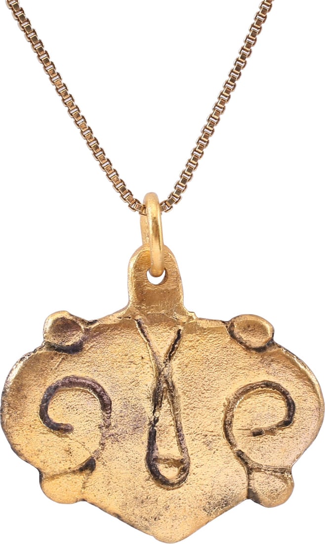 FINE VIKING HEART PENDANT 850-950 AD: Just under 1" (0.97”) width, made by the open face mold method. Large heart form with nubbed quarter points and of rounded edge flat section. The face hand is incised with addorsed scrolls
