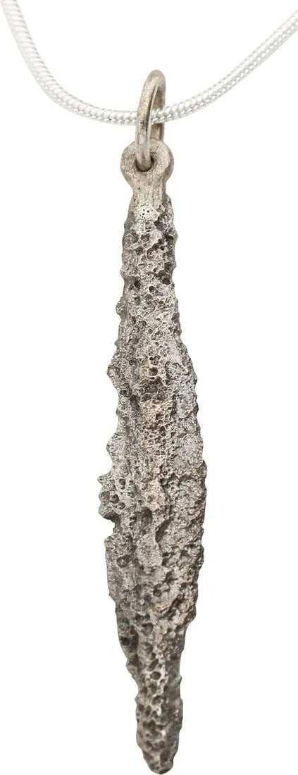 GREEK COMMERCE “COIN” NECKLACE C.700 BC: Predating coinage, these tokens, sometimes called arrowhead money, were used to facilitate the trade in slaves and food crops. This one is bronze, 7/8” in length plus the suspension loop, and 27