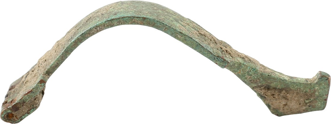 GREEK BROOCH, FIBULA, 2ND CENTURY BC.: The original garment pin was patented 2000 years later as the " safety pin" . Bow fibula, bronze, 2 1/8" length, of high arched form with a nub finial. Surface lightly encrusted from burial. Probably