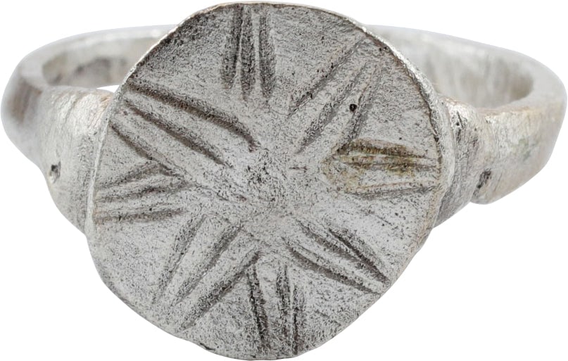 FINE MEDIEVAL RING, C.9TH-12TH CENTURY AD, SIZE 8 ½: The Viking period through early Crusades. Gilt bronze, size 8 1/2. Rounded face 2.2mm width band flaring to the dimples shoulders. The circular bezel double bordered and radially incised on the unders